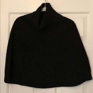 Black knitted turtleneck cape